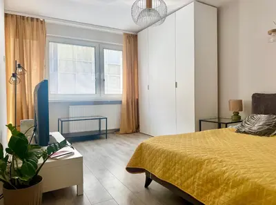 Łóżko lub łóżka w pokoju w obiekcie Cozy Stay City Center Apartment Warsaw