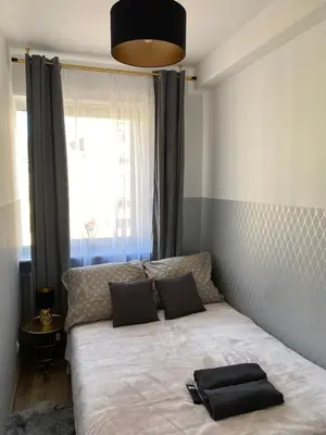 Łóżko lub łóżka w pokoju w obiekcie ClickTheFlat Moczydło Apart Rooms