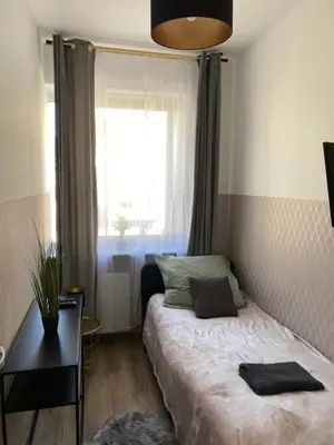 Łóżko lub łóżka w pokoju w obiekcie ClickTheFlat Moczydło Apart Rooms