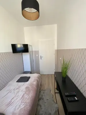 Łóżko lub łóżka w pokoju w obiekcie ClickTheFlat Moczydło Apart Rooms