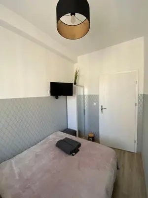 Łóżko lub łóżka w pokoju w obiekcie ClickTheFlat Moczydło Apart Rooms