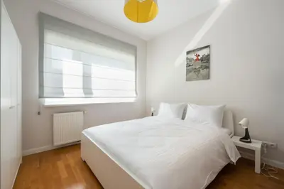 Łóżko lub łóżka w pokoju w obiekcie Mokotów Serenity Premium Apartment by BookingHost
