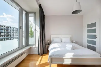 Łóżko lub łóżka w pokoju w obiekcie Mokotów Serenity Premium Apartment by BookingHost