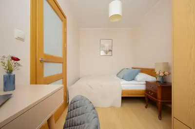 Łóżko lub łóżka w pokoju w obiekcie Perfectly Located Exceptional Apartment in Warsaw by Noclegi Renters