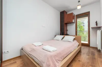 Łóżko lub łóżka w pokoju w obiekcie Jana Kazimierza 28 by Homeprime