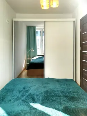 Łóżko lub łóżka w pokoju w obiekcie Green Warsaw Experience