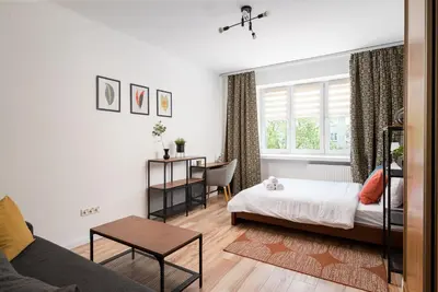 Łóżko lub łóżka w pokoju w obiekcie Metro Młynów Comfort Apartment by Bookinghost