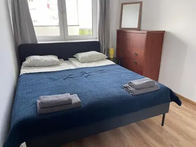 Łóżko lub łóżka w pokoju w obiekcie Plac Zawiszy by VAYA STAYS