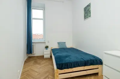 Łóżko lub łóżka w pokoju w obiekcie Mokotowska Apt 10 ROOMS SuperApart