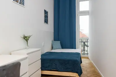 Łóżko lub łóżka w pokoju w obiekcie Mokotowska Apt 10 ROOMS SuperApart