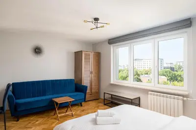 Łóżko lub łóżka w pokoju w obiekcie Wola Smocza Comfort Studio by BookingHost