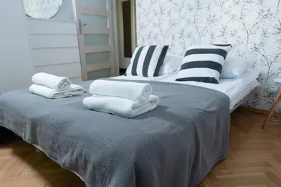 Łóżko lub łóżka w pokoju w obiekcie Downtown Living Franciszkanska 2 Rooms