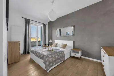 Łóżko lub łóżka w pokoju w obiekcie Włodarzewska Apt - 55m2, Parking, Balcony - by Rentujemy