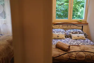 Łóżko lub łóżka w pokoju w obiekcie City Heart Apartment