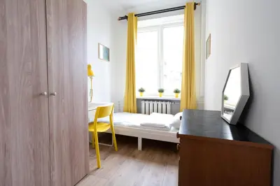 Łóżko lub łóżka w pokoju w obiekcie Central flat at plac Konstytucji