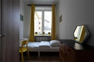 Łóżko lub łóżka w pokoju w obiekcie Central flat at plac Konstytucji