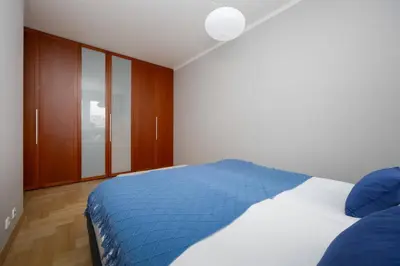 Łóżko lub łóżka w pokoju w obiekcie Wooden Apartment Żytnia in Warsaw with Parking by Noclegi Renters