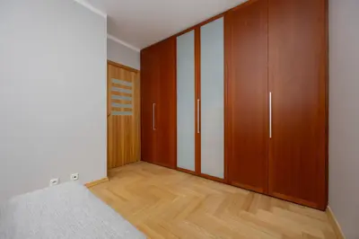 Łóżko lub łóżka w pokoju w obiekcie Wooden Apartment Żytnia in Warsaw with Parking by Noclegi Renters