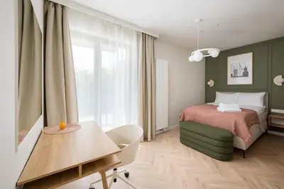 Łóżko lub łóżka w pokoju w obiekcie Malinova Leaf Apartment by BookingHost