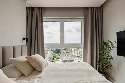 Łóżko lub łóżka w pokoju w obiekcie View 21 Floor The WAW Wars