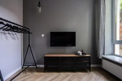 Telewizja i/lub zestaw kina domowego w obiekcie Close - Cozy and Modern Apartments - Praga Północ - Ząbkowska A