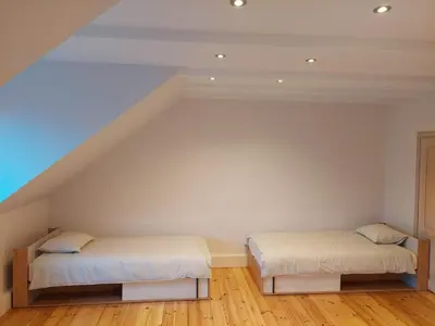 Łóżko lub łóżka w pokoju w obiekcie Two-level Sielecka Apartment