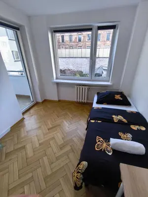 Łóżko lub łóżka w pokoju w obiekcie Fantastic-Inn Warszawa - Hoża