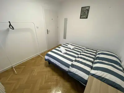 Łóżko lub łóżka w pokoju w obiekcie Fantastic-Inn Warszawa - Hoża