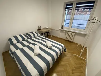 Łóżko lub łóżka w pokoju w obiekcie Fantastic-Inn Warszawa - Hoża