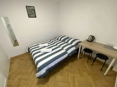 Łóżko lub łóżka w pokoju w obiekcie Fantastic-Inn Warszawa - Hoża