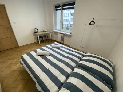 Łóżko lub łóżka w pokoju w obiekcie Fantastic-Inn Warszawa - Hoża
