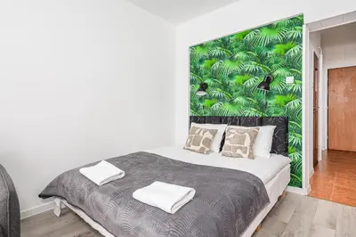 Łóżko lub łóżka w pokoju w obiekcie ShortStayPoland Anielewicza B130