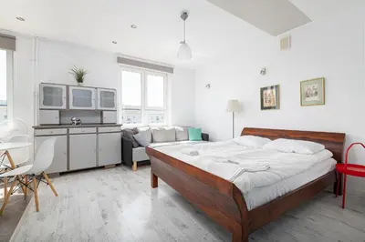 Łóżko lub łóżka w pokoju w obiekcie RentPlanet - Apartament przy Hali Mirowskiej