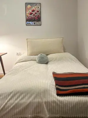 Łóżko lub łóżka w pokoju w obiekcie Paryska Apartament