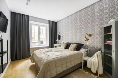 Łóżko lub łóżka w pokoju w obiekcie Apartament w kamienicy na Żurawiej