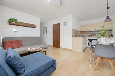 Część wypoczynkowa w obiekcie Atmospheric Apartment for 5 Peoples in Warsaw by Noclegi Renters