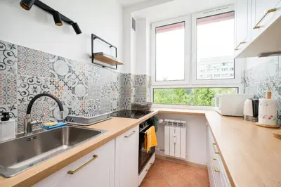 Kuchnia lub aneks kuchenny w obiekcie Krasińskiego Homely Apartment by BookingHost