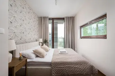 Łóżko lub łóżka w pokoju w obiekcie Ochota Prime Loft Apartment by BookingHost