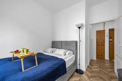 Łóżko lub łóżka w pokoju w obiekcie Bokserska Apt - Chopin Airport Nerby - by Rentujemy
