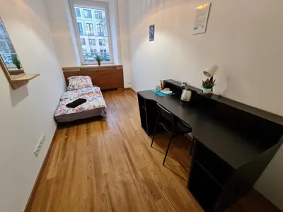 Łóżko lub łóżka w pokoju w obiekcie Fantastic-Inn Warszawa - Czackiego