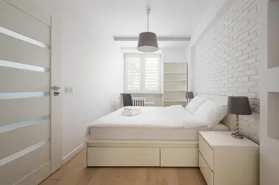 Łóżko lub łóżka w pokoju w obiekcie Plac Wilsona Modern Apartment by BookingHost