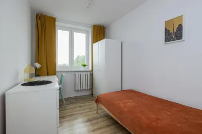 Łóżko lub łóżka w pokoju w obiekcie Leszno 34-36 Rooms SuperApart