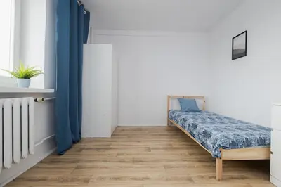 Łóżko lub łóżka w pokoju w obiekcie Leszno 34-36 Rooms SuperApart