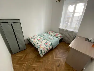 Łóżko lub łóżka w pokoju w obiekcie Fantastic-Inn Warszawa - Kozia