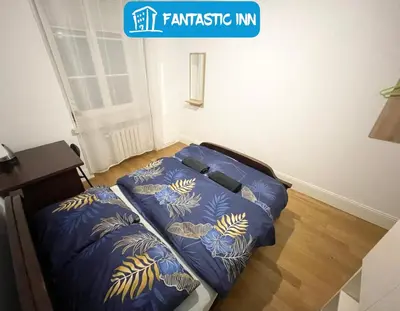 Łóżko lub łóżka w pokoju w obiekcie Fantastic-Inn Warszawa - Kozia