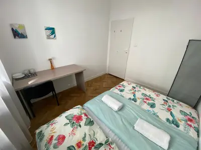 Łóżko lub łóżka w pokoju w obiekcie Fantastic-Inn Warszawa - Kozia
