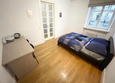 Łóżko lub łóżka w pokoju w obiekcie Fantastic-Inn Warszawa - Kozia