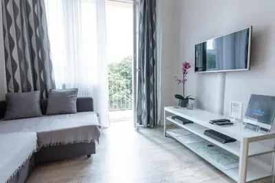 Telewizja i/lub zestaw kina domowego w obiekcie Rental Apartments Krochmalna