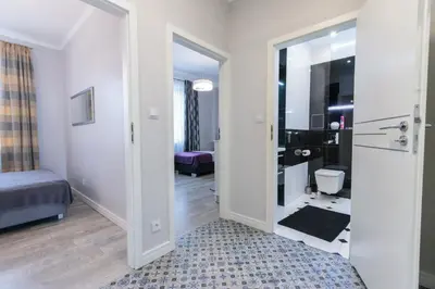 Łóżko lub łóżka w pokoju w obiekcie Rental Apartments Krochmalna