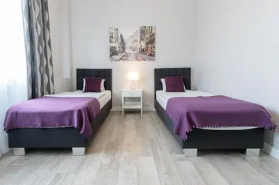Łóżko lub łóżka w pokoju w obiekcie Rental Apartments Krochmalna